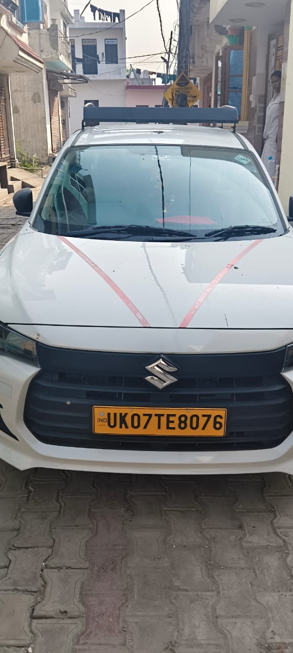 Shree Ji Travels sedan — front view, full photo