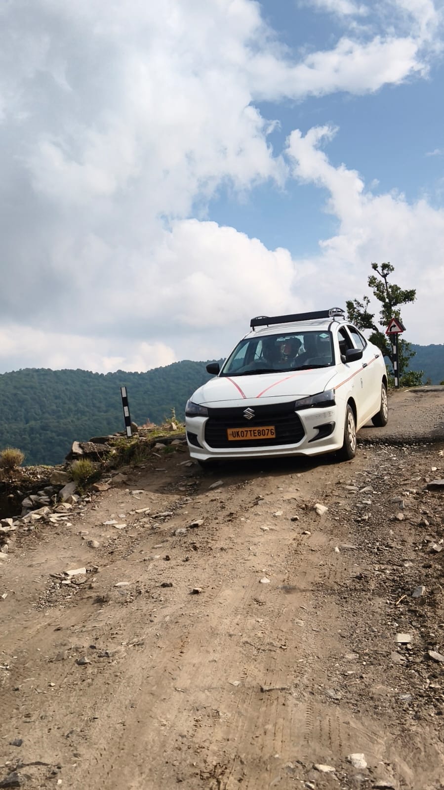 Sedan cab on mountain road, full photo