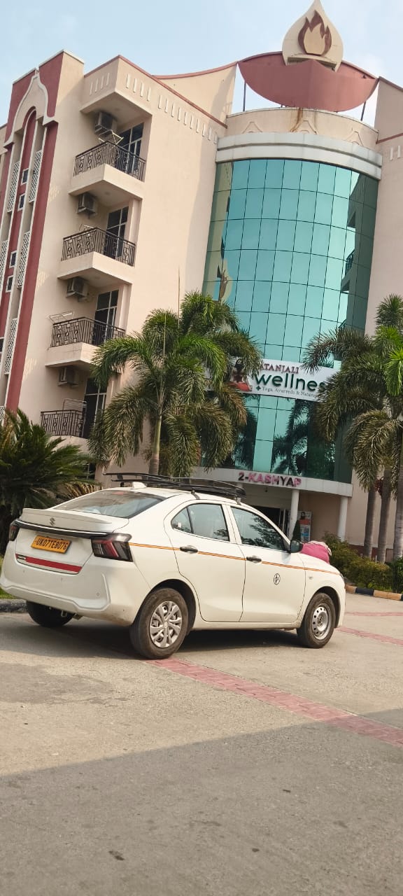 Shree Ji Travels sedan cab on duty, full photo